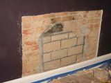 Neighbor's fireplace is cooking my wall -- how hot is too hot?