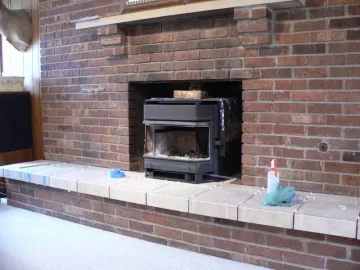 [Hearth.com] Been waiting to post my Osburn2200i install so I could tell how I like it.  GREAT STOVE, WE LOVE IT!