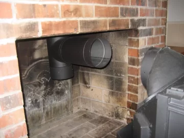 [Hearth.com] Rear vent wood stove through masonry fireplace