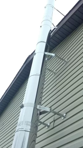 [Hearth.com] Outside chimney install question (through eave?)