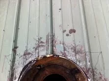 [Hearth.com] Stove pipe flashing on corrugated metal roof.