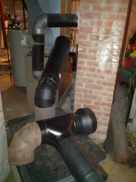 [Hearth.com] Oil Furnace and wood stove with a tee to the same chimney flue...