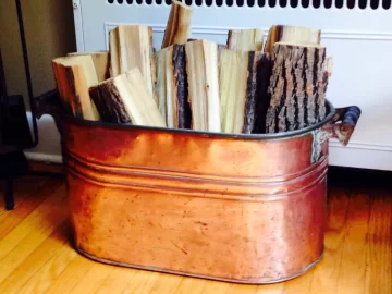 [Hearth.com] Antique copper tub for hearthside wood storage.