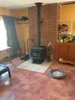 [Hearth.com] locate stove in middle of room?