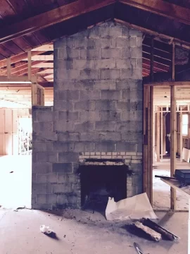 [Hearth.com] Freestanding Stove in Fireplace.