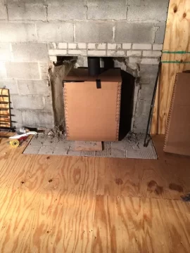 [Hearth.com] Freestanding Stove in Fireplace.