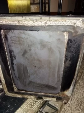 [Hearth.com] Fireplace Insert Glass Doors...Dirty Glass or Some Type of Metal??