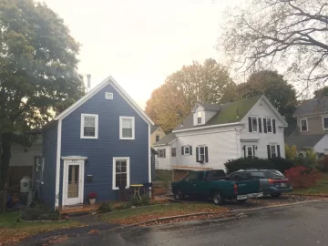 [Hearth.com] A woodstove storyVermont Castings Intrepid on soapstone hearth with built in wood box