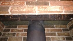 Insulating above stove, between metal and brick?