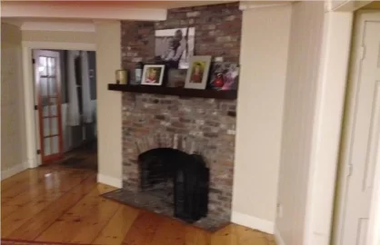 [Hearth.com] what all would be involved in getting a big freestanding woodstove into this fireplace?