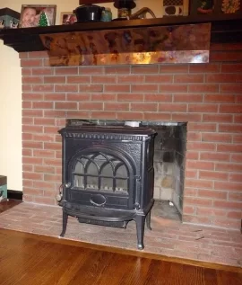 [Hearth.com] Wood stove inside fireplace