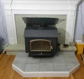 [Hearth.com] Freestanding stove install venting through masonry fireplace.