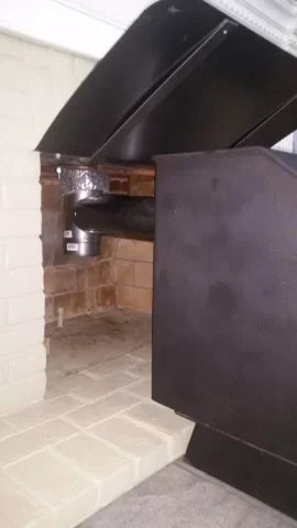 [Hearth.com] Freestanding stove install venting through masonry fireplace.