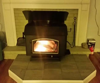 [Hearth.com] Freestanding stove install venting through masonry fireplace.