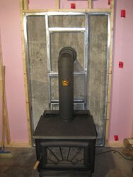 [Hearth.com] pipe in enclosed, non combustible wall, ok with combustible wall attached?