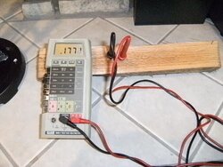 Using a multimeter to measure wood moisture level