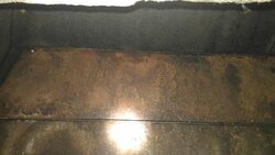 Rust holes in what I believe to be a ventilator brick and mortar with metal liner fireplace