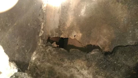 [Hearth.com] Rust holes in what I believe to be a ventilator brick and mortar with metal liner fireplace