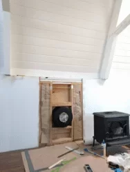 [Hearth.com] Insulation with paper facing in wall behind stove