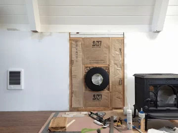 [Hearth.com] Insulation with paper facing in wall behind stove