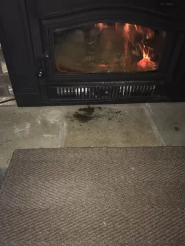 [Hearth.com] Log rolled and is touching the glass