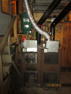 [Hearth.com] Two indoor boilers plumbed together.