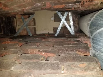 [Hearth.com] Crumbling brick chimney stack in 120 year old home