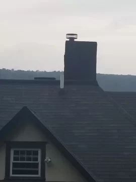 [Hearth.com] Crumbling brick chimney stack in 120 year old home