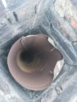 [Hearth.com] Crumbling brick chimney stack in 120 year old home