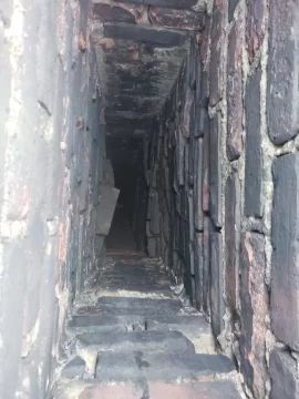 [Hearth.com] Crumbling brick chimney stack in 120 year old home