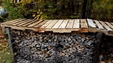 [Hearth.com] My idea of covering wood with pallets to create overhang.