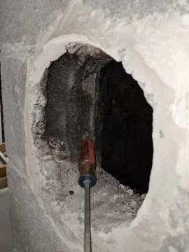 [Hearth.com] Stove pipe through clay thimble