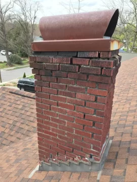 [Hearth.com] Liner and cap on a 100 year old Chimney with rectangular flue