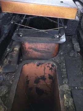 [Hearth.com] Liner and cap on a 100 year old Chimney with rectangular flue