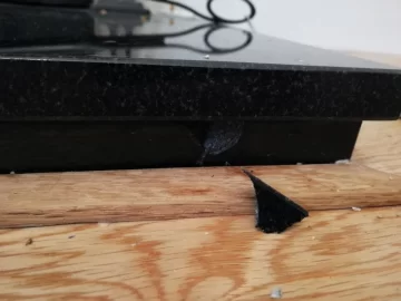 [Hearth.com] Granite hearth damaged by lack of floorboard expansion gap