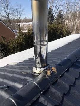 [Hearth.com] Chimney dripping brown stuff on new metal roof - concerned of damage and root cause