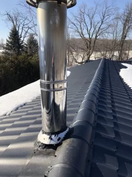 [Hearth.com] Chimney dripping brown stuff on new metal roof - concerned of damage and root cause