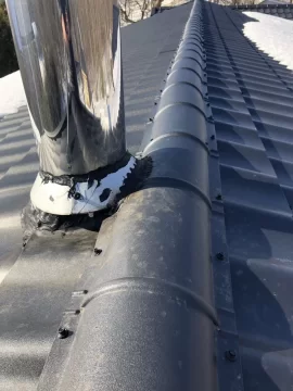 [Hearth.com] Chimney dripping brown stuff on new metal roof - concerned of damage and root cause