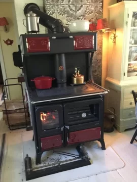 [Hearth.com] Guy at the fireplace store says our new stove set up won't draft