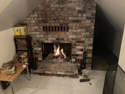 Adding a small wood stove to a 1970s brick chimney that has a capped hole and platform for stove