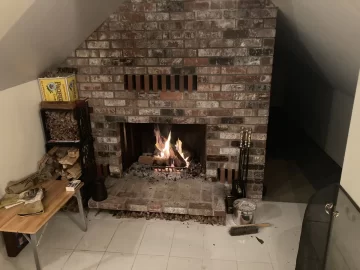 [Hearth.com] Adding a small wood stove to a 1970s brick chimney that has a capped hole and platform for stove