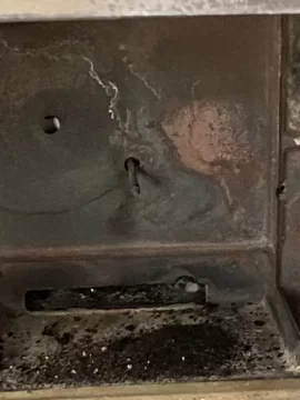 [Hearth.com] Metal sticking out inside back of stove