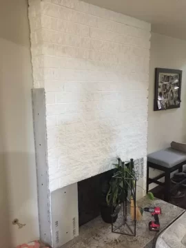 [Hearth.com] Stacked stone over painted fireplace