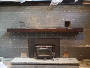 [Hearth.com] Stacked stone over painted fireplace