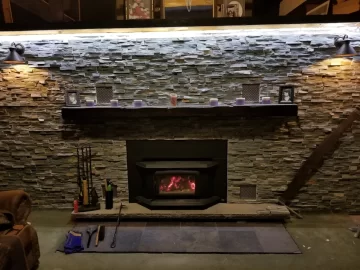 [Hearth.com] Stacked stone over painted fireplace