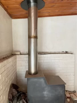 [Hearth.com] old mama bear that has the stove pipe coming out of the upper top plate.