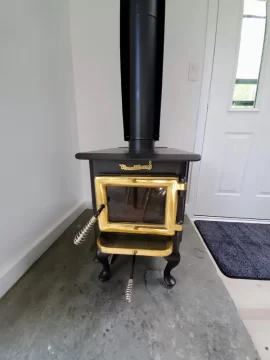 [Hearth.com] My Brass Flame Wood Stove