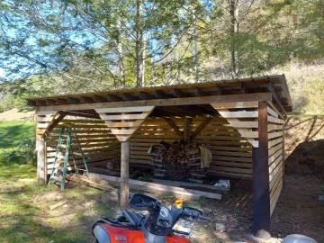 [Hearth.com] Economical wood shed with power poles