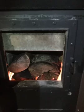 [Hearth.com] Kuuma Vapor Fire reload on small bed of coals