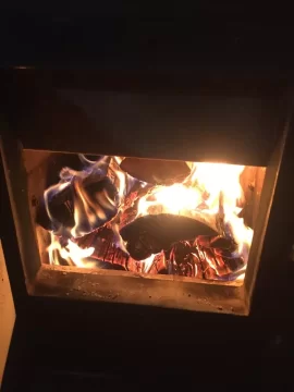 [Hearth.com] Kuuma Vapor Fire reload on small bed of coals